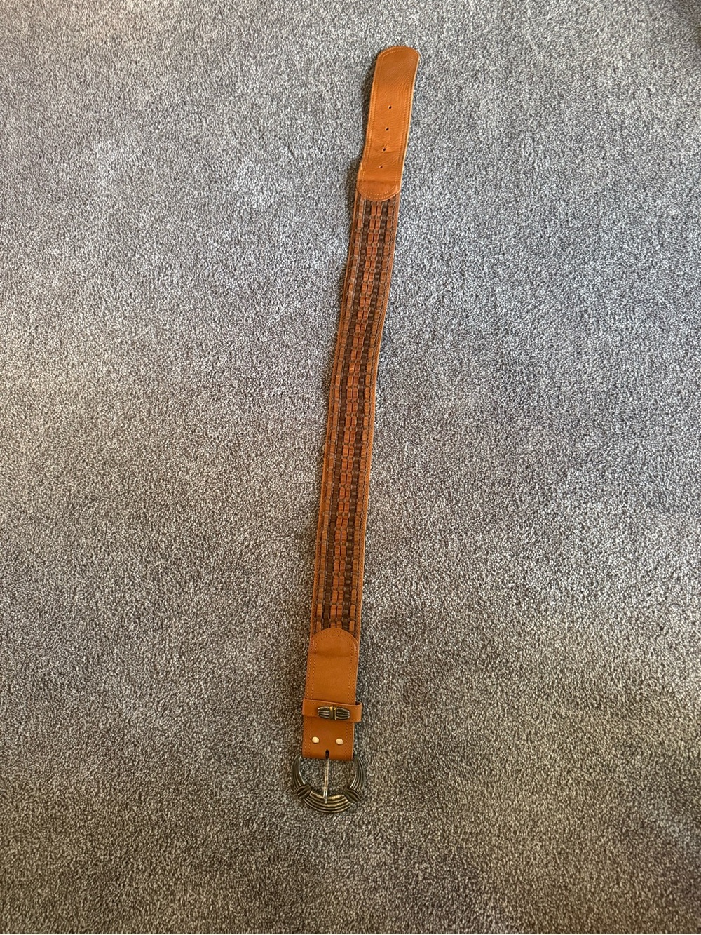Brown leather belt with silver buckle